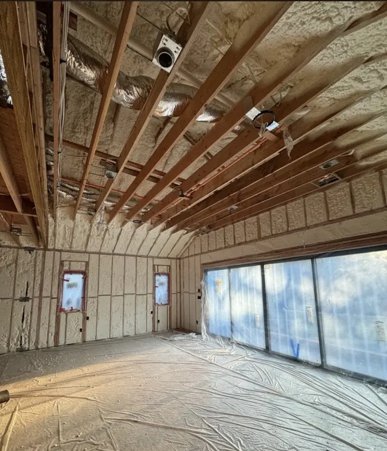 Interior walls and ceiling insulated with spray foam during new construction in Point Pleasant Beach
